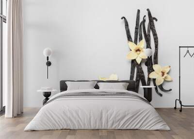 Aromatic vanilla sticks and flowers on grey background Wall mural