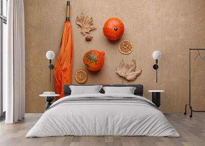 Autumn composition with fresh pumpkins and umbrella on color background Wall mural