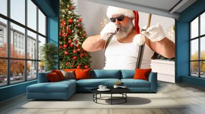 Bad Santa Claus with cigar drinking whiskey at Christmas party Wall mural