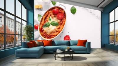 Baking dish of pasta with tomato sauce and cheese on white background Wall mural