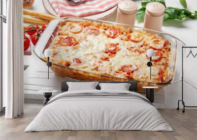 Baking dish with tasty rice casserole on table Wall mural