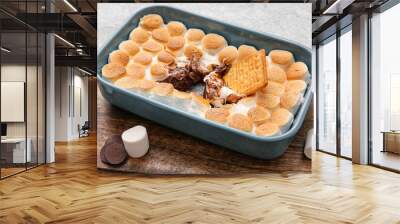 Baking dish with tasty S'mores dip on table, closeup Wall mural