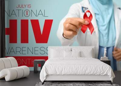 Banner for National HIV Awareness Month with female doctor holding red awareness ribbon Wall mural