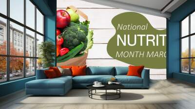 Banner for National Nutrition Month with fresh vegetables and fruits in shopping bag Wall mural