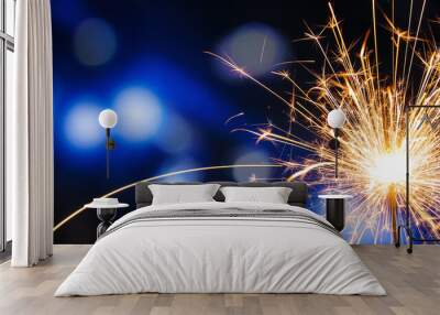 Beautiful Christmas sparkler at night, closeup Wall mural