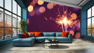 Beautiful Christmas sparklers on dark background with blurred lights Wall mural