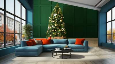 Beautiful Christmas tree with gifts near green wall Wall mural