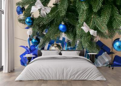 Beautiful Christmas tree with presents in room, closeup Wall mural