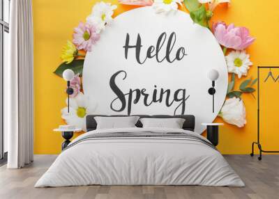 Beautiful flowers and card with text HELLO SPRING on color background Wall mural