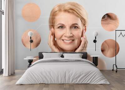 Beautiful mature woman with skin problem on light background. Process of aging Wall mural