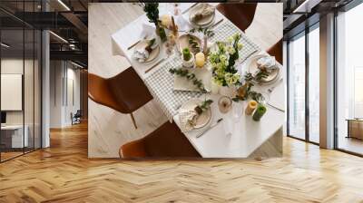 Beautiful table setting with eustoma flowers and eucalyptus for wedding celebration in room, top view Wall mural