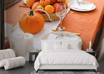 Beautiful table setting with pumpkins in dining room Wall mural