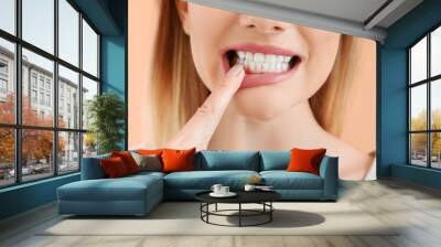 Beautiful woman with healthy teeth on color background, closeup Wall mural