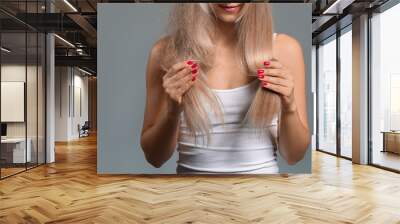 Beautiful young woman before and after hair treatment on grey background Wall mural