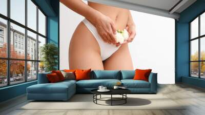 Beautiful young woman in panties with carnation flowers on white background, closeup Wall mural