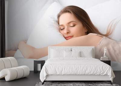 Beautiful young woman sleeping in bed Wall mural