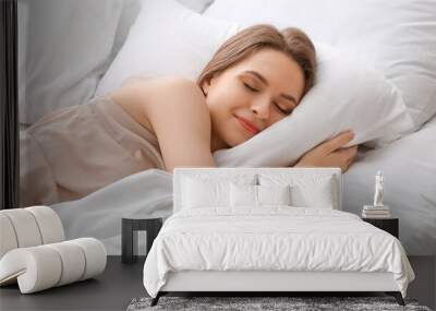 Beautiful young woman sleeping in bed Wall mural