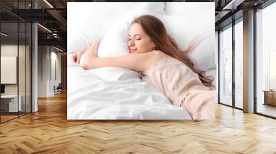 Beautiful young woman sleeping in bed Wall mural