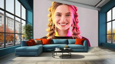 Beautiful young woman with braided hair on grey background Wall mural