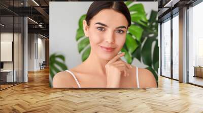 Beautiful young woman with healthy skin at home Wall mural