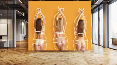 Beautiful young women after weight loss on orange background Wall mural