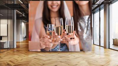 Beautiful young women drinking champagne at hen party Wall mural