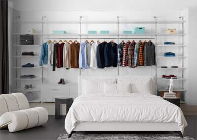 Big wardrobe with clothes in dressing room Wall mural