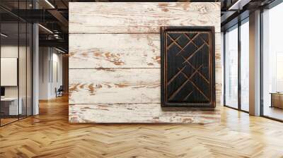 Black wooden cutting board on white table Wall mural