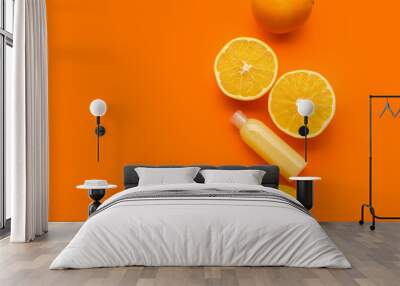 Bottle of cosmetic product with vitamin C and oranges on color background Wall mural