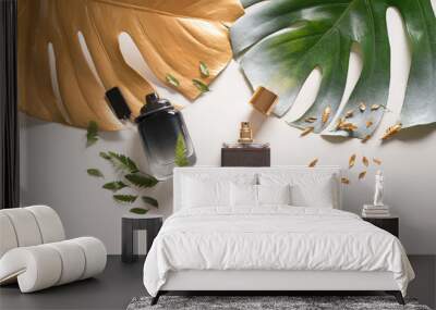 bottles with perfumes and tropical leaves on light background Wall mural