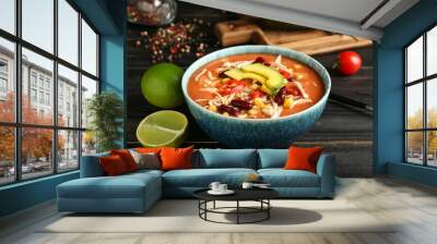 Bowl of tasty chicken enchilada soup on table Wall mural