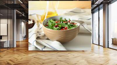 Bowl with delicious healthy fresh salad on table Wall mural