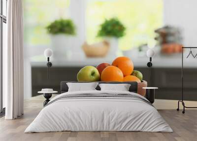 Bowl with fruits on table in modern kitchen Wall mural