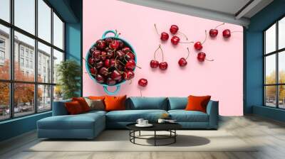 Bowl with sweet cherries on pink background Wall mural