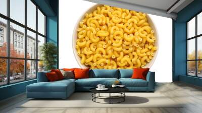 Bowl with tasty raw elbow pasta on white background Wall mural