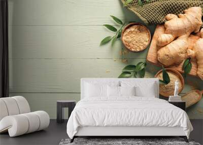 Bowls with ground ginger and roots on color wooden table Wall mural