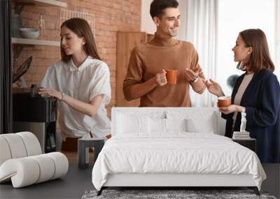 Business colleagues drinking coffee in office Wall mural