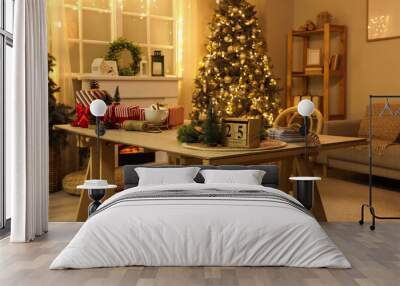 Calendar with date of Christmas, decor and presents on table in living room at night Wall mural