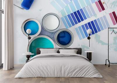 Cans of paint with palette samples on light background Wall mural