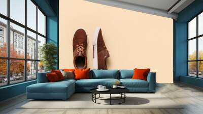 Casual male shoes on color background Wall mural