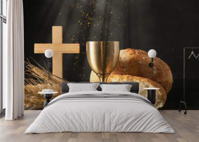 chalice of wine with bread and cross on dark background. holy communion concept Wall mural