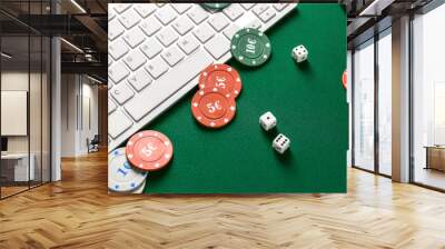 Chips for gambling games, dices with computer keyboard on color background Wall mural