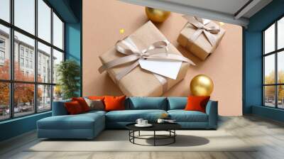 Christmas balls and gift boxes on brown background Wall mural