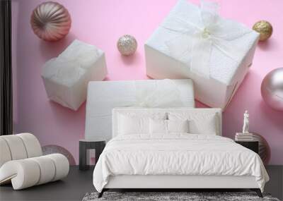 Christmas balls and gift boxes on pink background Wall mural