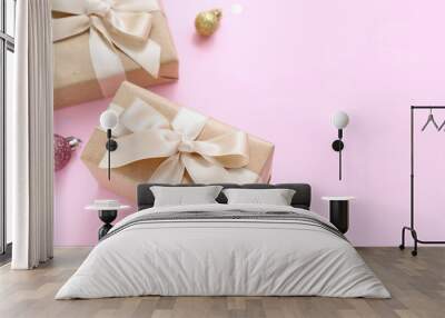 Christmas balls and gift boxes on pink background Wall mural