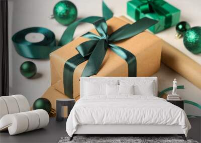 Christmas gift boxes with packing materials and decorations on white background Wall mural