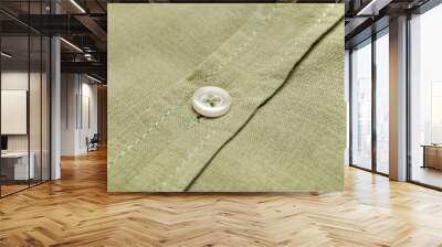 Closeup view of linen male shirt with button Wall mural