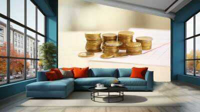 Coins and chart on table. Money savings concept Wall mural