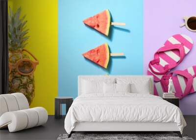 Collage of beach accessories with tropical leaf, fresh fruits and bottle of cocktail on color background. Hello summer Wall mural