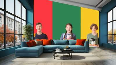 Collage of different little children with piggy banks on color background Wall mural